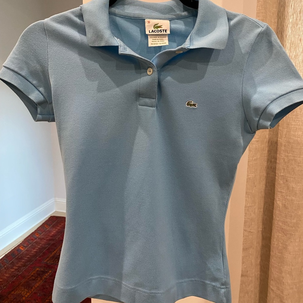 Lacoste blue polo. Size 36 (xs).  Lightly worn.